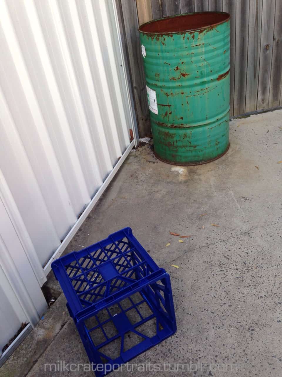 Crate and 40 gallon drum