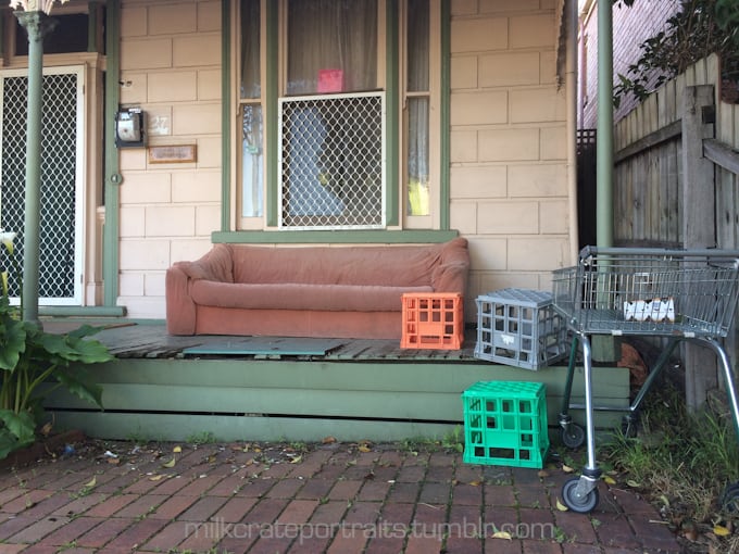 Old house with milk crates and trolley